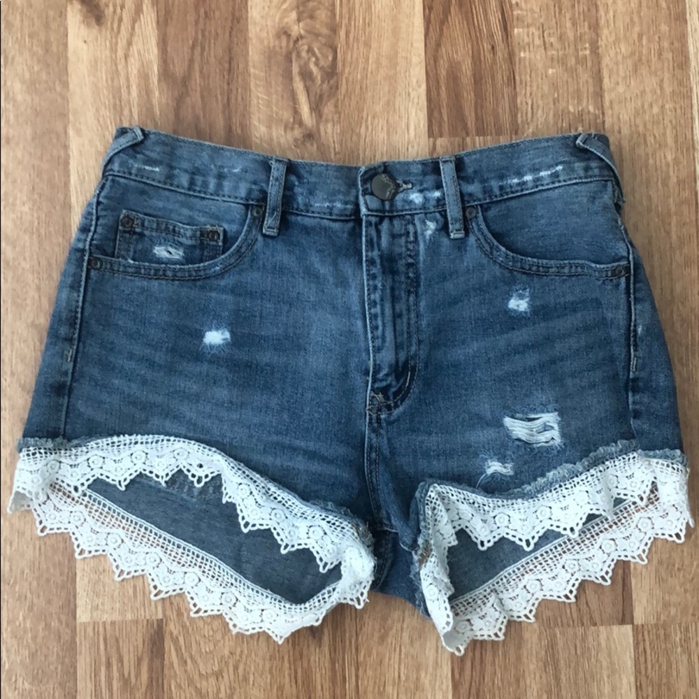 Free People Denim Shorts with lace trim. Size 26
